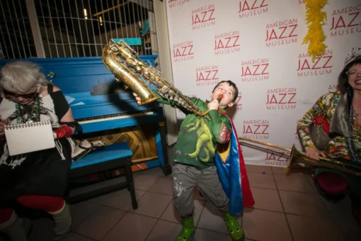 Young boy playing a saxophone